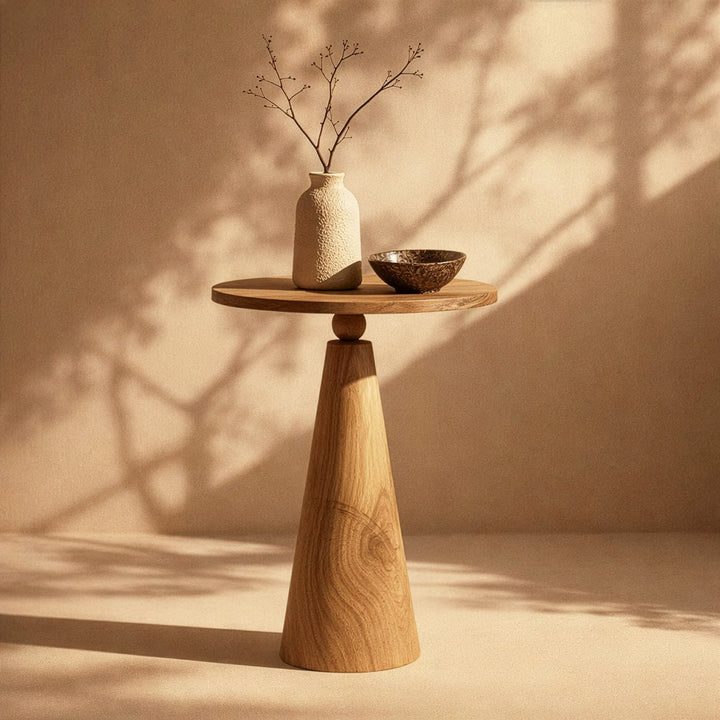 masif ceviz mantar sehpa uzerinde seramik vazoya yerlestirilmis ince dallar ve  kase vornom