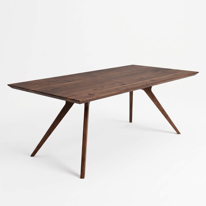 Modern indoor dining set featuring Vigo solid walnut wooden table and upholstered chairs   